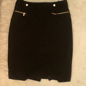 This a black classy mid thigh skirt.